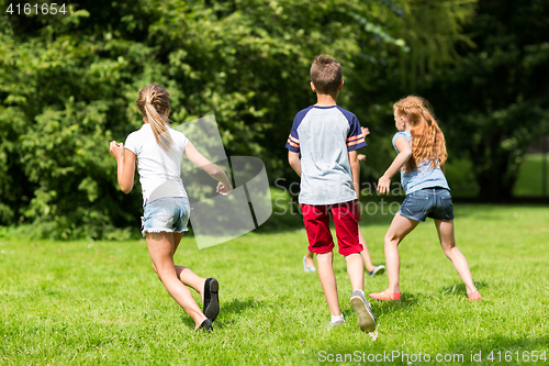 Image of group of happy kids or friends playing outdoors