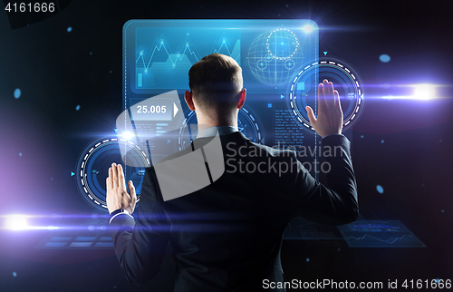 Image of businessman working with virtual screens