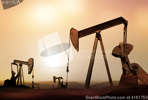 Image of silhouette of retro oil pumps