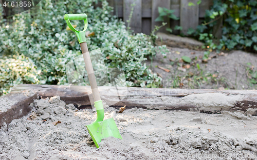 Image of Little shovel in the sand