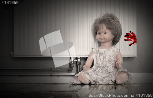 Image of Concept of child abuse - Bloody doll
