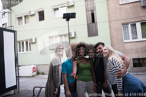 Image of Group of friends taking picture of themselves