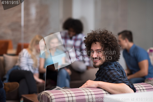 Image of Portrait of young informal businessman
