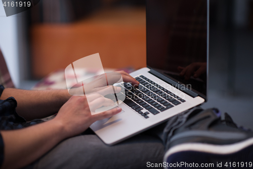 Image of man working with laptop