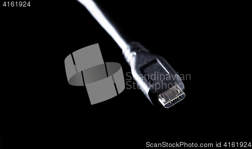 Image of Usb cord on black background