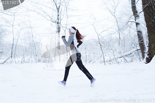 Image of Winter landscape with running girl