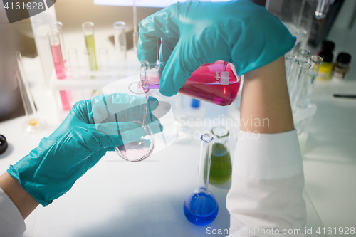 Image of Chemical lab with technician, flasks