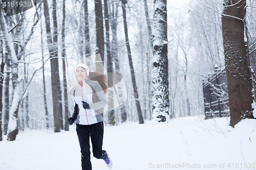 Image of Photo of young sportswoman running