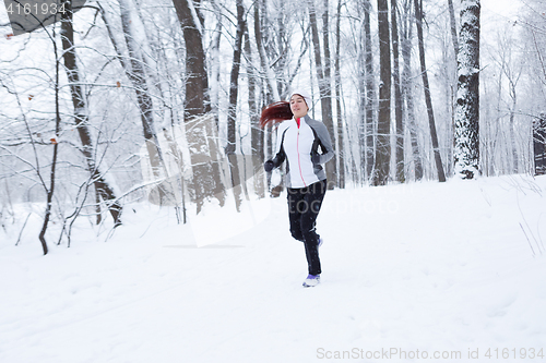 Image of Young girl running on morning