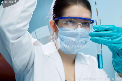 Image of Laboratory technician with test tube