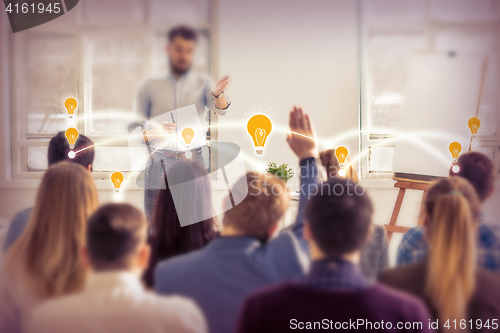 Image of Speaker at Business Meeting in the conference hall.