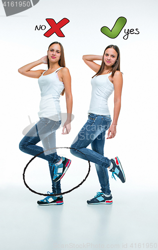 Image of conceptual portrait of two beautiful twin young women