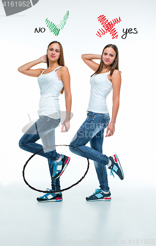 Image of conceptual portrait of two beautiful twin young women