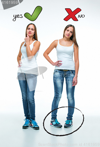 Image of conceptual portrait of two beautiful twin young women