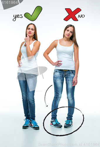 Image of conceptual portrait of two beautiful twin young women