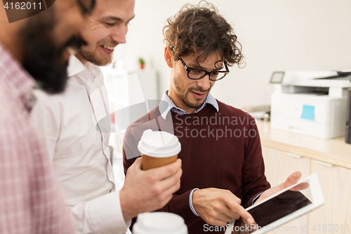 Image of business team with tablet pc and coffee at office