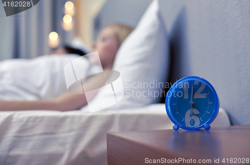 Image of close up of alarm clock in bedroom