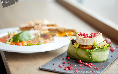 Image of goat cheese salad and gazpacho soup at restaurant