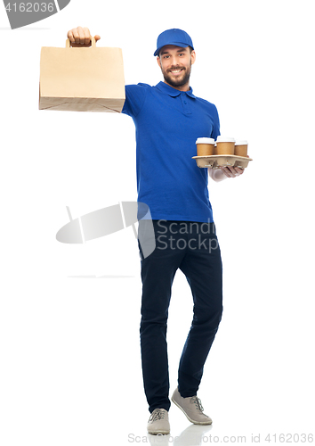 Image of happy delivery man with coffee and food in bag