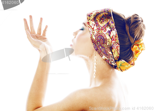 Image of young pretty modern girl with bright shawl on head emotional posing isolated on white background, asian people ethnicity