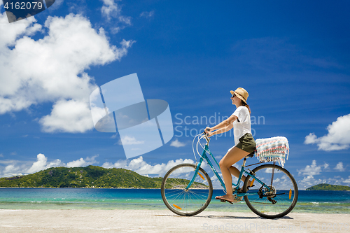 Image of Woman ride along The Beach