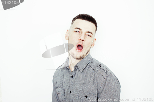 Image of young handsome well-groomed guy posing emotional on white background, lifestyle people concept 