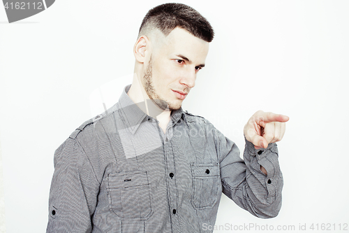 Image of young handsome well-groomed guy posing emotional on white background, lifestyle people concept 