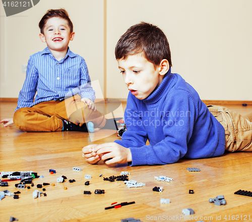 Image of funny cute children playing at home, boys and girl smiling, first education role lifestyle