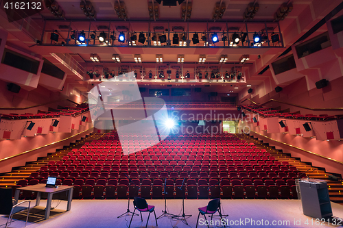 Image of Red interior of empty conference hall.