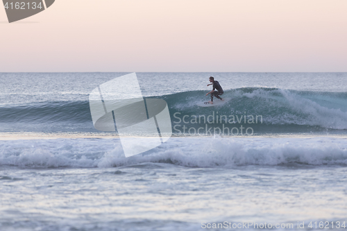 Image of Body surfer riding a perfect wave.