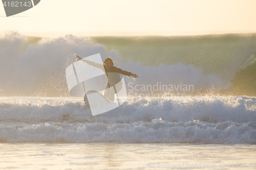 Image of Body surfer riding a perfect wave.