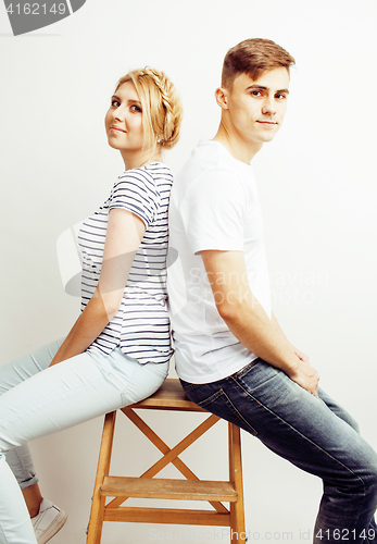 Image of young pretty teenage couple, hipster guy with his girlfriend happy smiling and hugging isolated on white background, lifestyle people concept