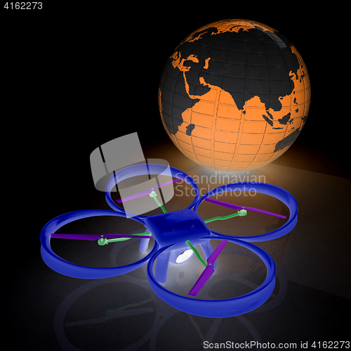 Image of Quadrocopter Drone with Earth Globe and remote controller on a w