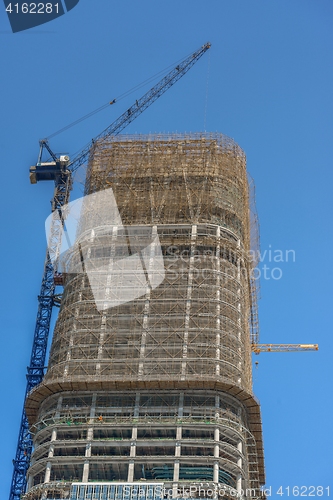 Image of Construction of skyscrapers under blue sky