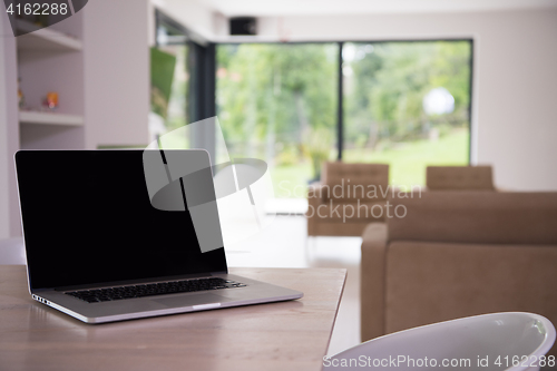 Image of Notebook with blank screen on table