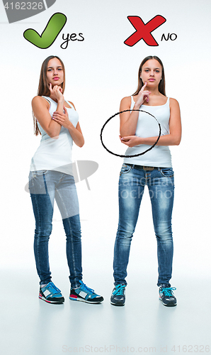 Image of conceptual portrait of two beautiful twin young women