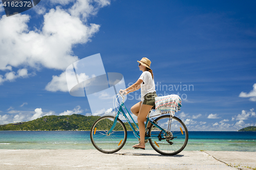 Image of Woman ride along The Beach