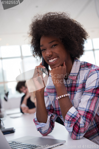 Image of African American informal business woman working in the office