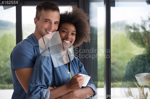 Image of romantic happy young couple relax at modern home indoors