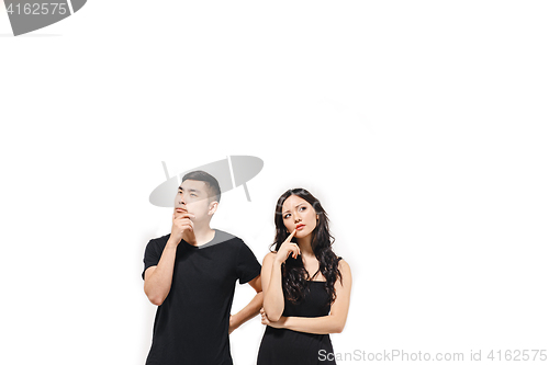 Image of Portrait of pensive Korean couple isolated on white