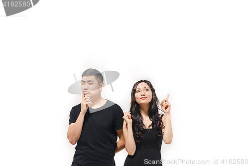 Image of Portrait of pensive Korean couple isolated on white