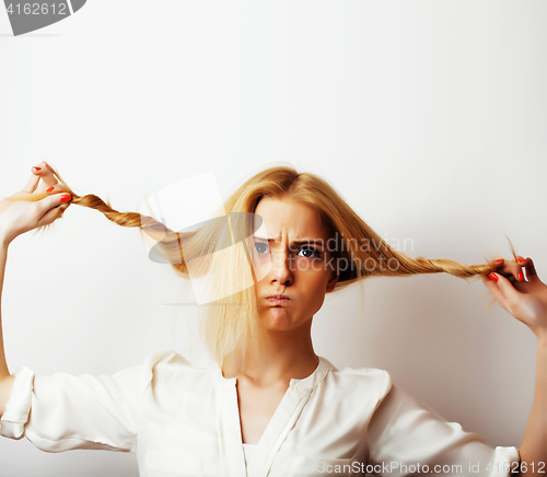 Image of young blond woman on white backgroung gesture thumbs up, isolate