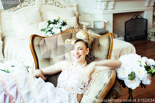 Image of beauty emotional blond bride in luxury interior