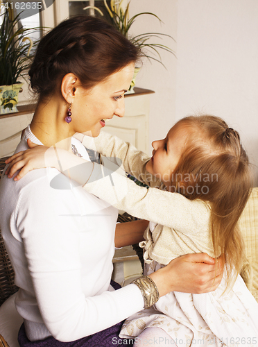 Image of young mother with daughter at luxury home interior vintage