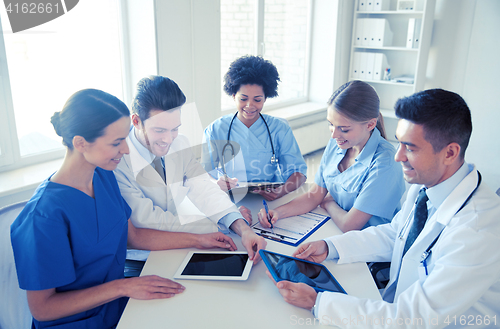 Image of group of happy doctors meeting at hospital office