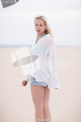 Image of Beautiful sensual girl alone at beach.