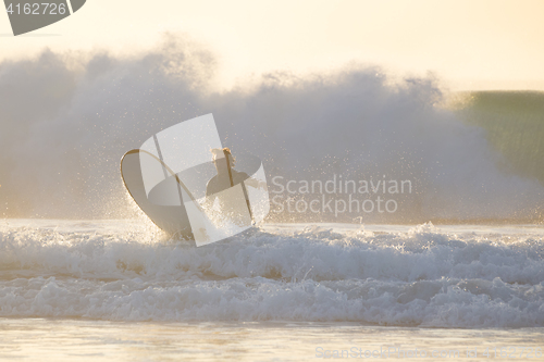 Image of Body surfer riding a perfect wave.