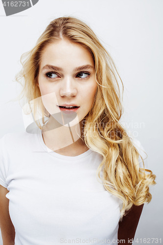 Image of young pretty blond teenage girl emotional posing, happy smiling isolated on white background, lifestyle people concept