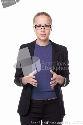 Image of Business woman standing with arms crossed against white background..