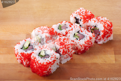 Image of california sushi rolls on wooden plate